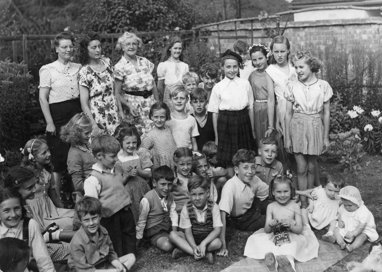 SKP 4th from left of adult gals mother Win center